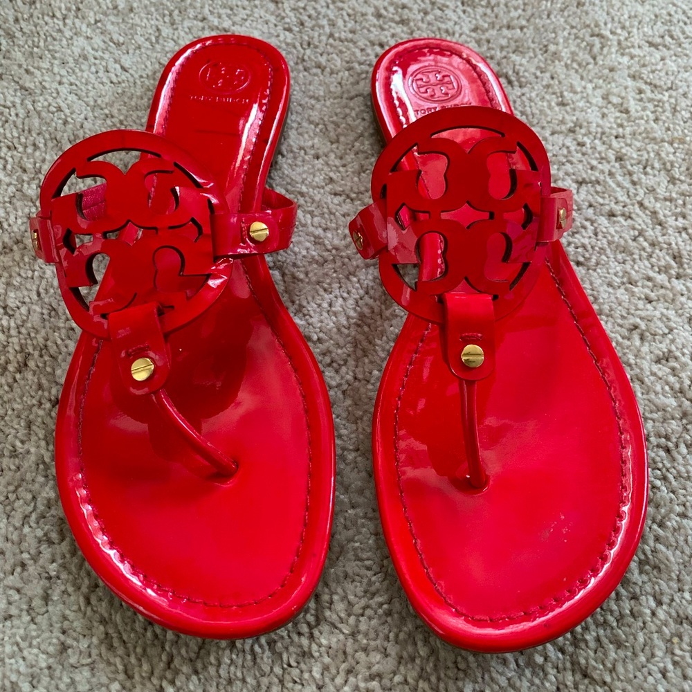Tory Burch Miller red calf leather thong sandals.